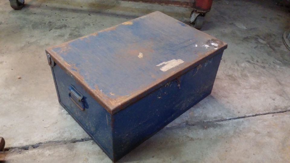 Blue metal toolbox with rust on edges
