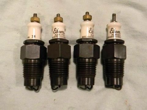 1915 Ford Model T - A set of four Edison spark plugs, each marked with 'Edison' and 'Made in United States'.