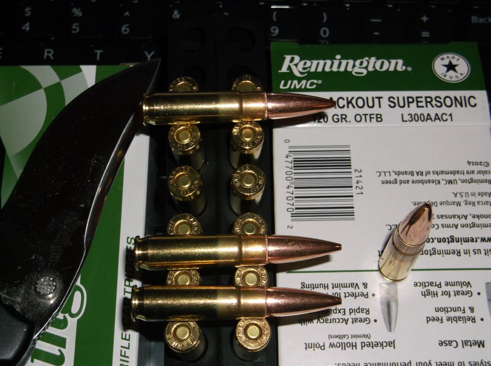 Remington UMC .300 AAC Blackout Supersonic ammunition with a knife.
