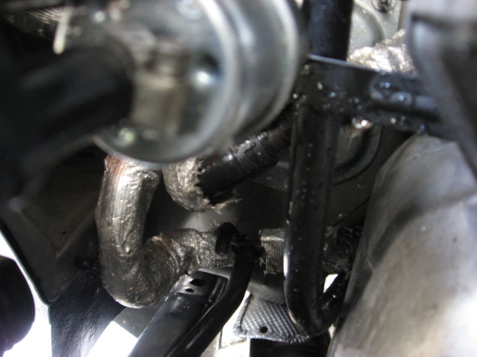 1994 Ford Bronco exhaust system with insulated pipes.