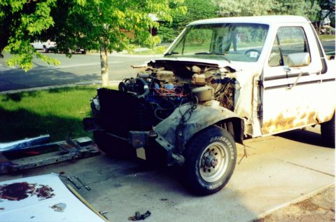 1981 Ford Bronco - This white Ford Bronco appears to be undergoing a significant rework, with its front end completely dismantled.