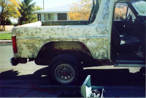 1981 Ford Bronco - This 1980s Ford Bronco is undergoing a total body rework, evident from the extensive paint and rust damage.