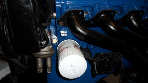 1972 Ford Ranchero - Close-up of a Motorcraft oil filter and fuel pump on a blue engine block.