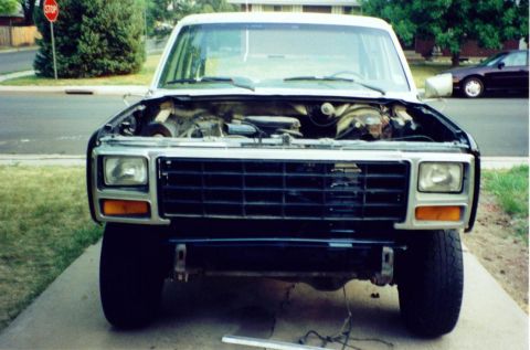 1981 Ford Bronco - Front view of a 1980 Ford Bronco with the hood open and bumper removed.