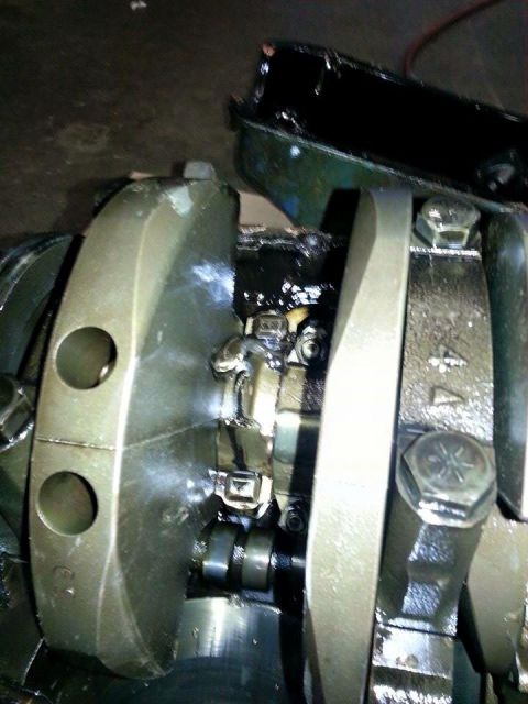 1979 Ford Bronco - Close-up view of engine crankshaft and connecting rods, showing internal engine components.