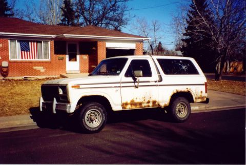 1981 Ford Bronco - This 1981 Ford Bronco shows significant rust, particularly along the lower body panels and rear quarter.