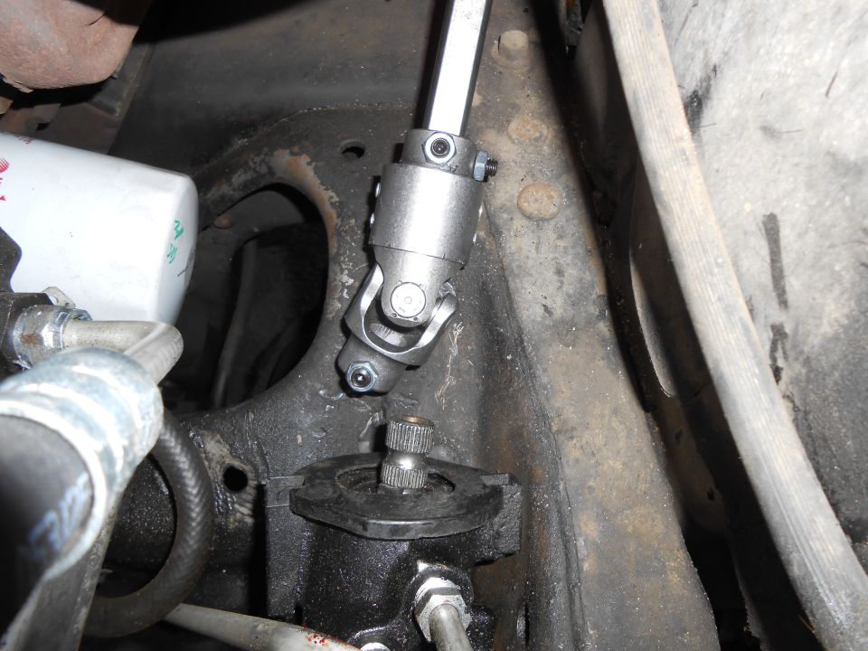 Re-attach other end of shaft to steering gearbox