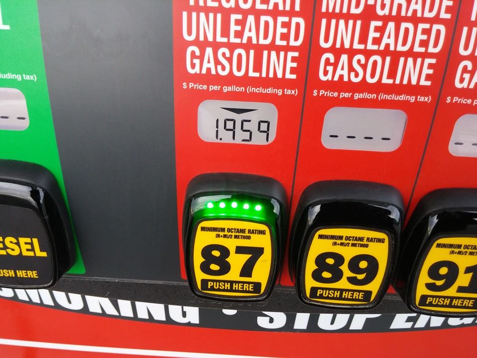 Gas pump display showing prices for regular, mid-grade, and premium unleaded gasoline
