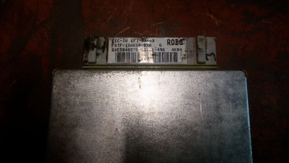 Automotive computer module with label and barcode