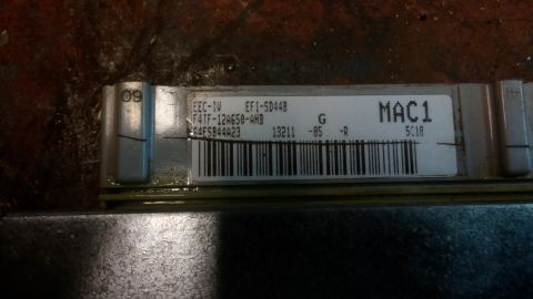 1995 Ford Bronco - A close-up of a Ford EEC-IV ECU with the part number F4TF-12A650-AHB visible. The ECU is labeled MAC1 and has a barcode below the text.