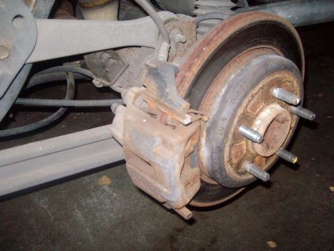 2004 Ford Crown Victoria - Factory rear brakes. Definately time for some upgrades. Calipers will get an upgrade as well.