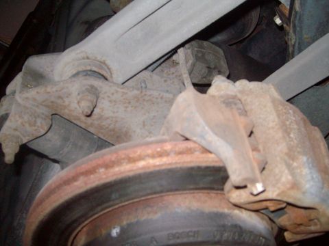 2004 Ford Crown Victoria - Lower view of control arms, rotor and caliper.