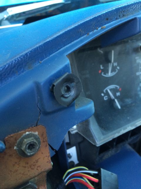 1990 Ford Bronco - Close-up of a vehicle's dashboard interior, revealing gauges and exposed wiring.