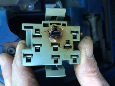 1990 Ford Bronco - This electrical relay socket shows significant heat damage and cracking.