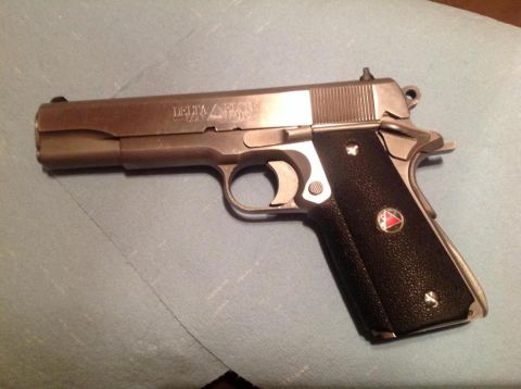 1979 Ford Bronco - Colt Delta Elite 10mm pistol shown from the side.