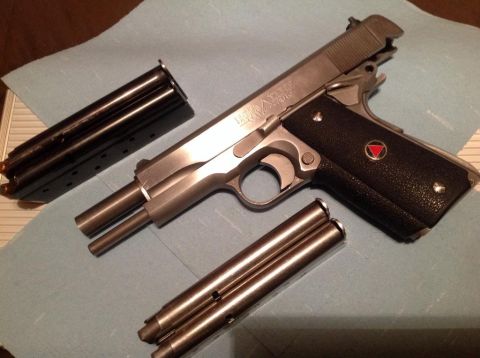 1979 Ford Bronco - A Colt Delta Elite pistol is shown disassembled with two magazines.