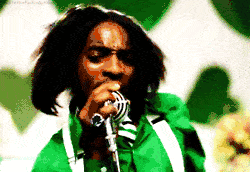 2000 Mercury Grand Marquis - A man passionately sings into a microphone, his hair blowing.