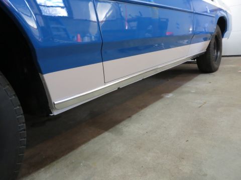 1991 Ford LTD Crown Victoria - Side view of a blue and white car with chrome trim along the lower body panel.