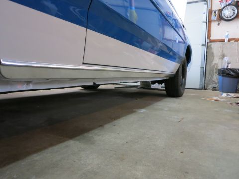 1991 Ford LTD Crown Victoria - Lower body panel and chrome trim on a two-tone blue and white vehicle.