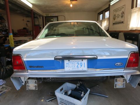 1991 Ford LTD Crown Victoria - This 1991 Ford Crown Victoria LTD police car is seen from the rear, a Massachusetts Metro Police license plate and a blue stripe along the…