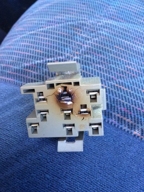 1990 Ford Bronco - This electrical connector shows significant heat damage and cracking, indicating a failure.
