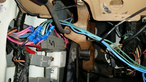 1991 Ford F-250 - This image shows a complex wiring harness with many colored wires and blue connectors, likely from a vehicle's interior.