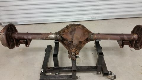 1970 Pontiac Trans Am - This rear axle assembly is mounted on stands, showing its drum brakes and differential housing.
