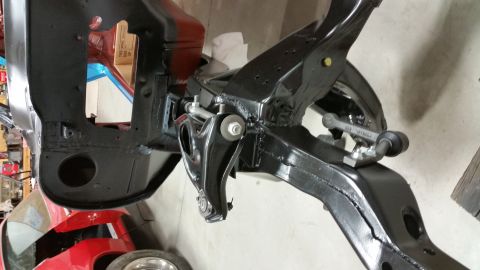 1970 Pontiac Trans Am - The image shows a close-up view of a car's frame and suspension system, likely during a restoration project.