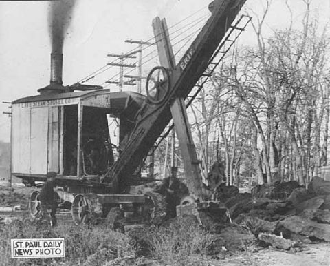 1909 Ford Model T - Steam shovel operating near trees and rocks. St. Paul Daily News Photo.