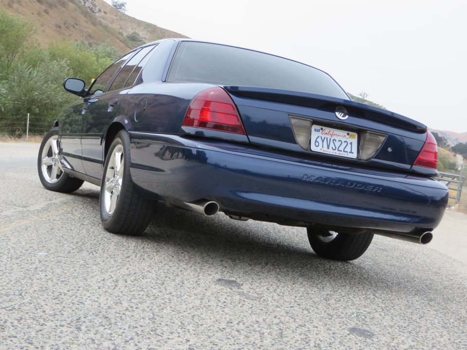 Rear view of a dark blue 2003 Mercury Marauder parked on a road