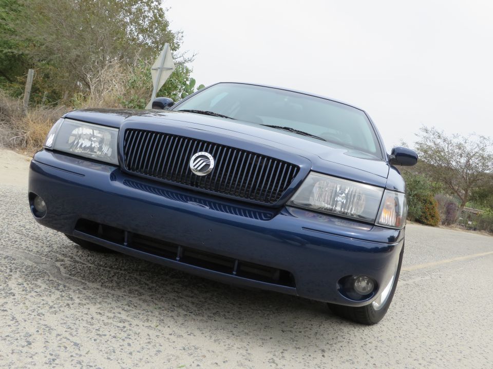 Blue 2003 Mercury Marauder front grille and headlights, angled view