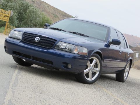2003 Mercury Marauder - Front 3/4 view of a blue 2003 Mercury Marauder with chrome wheels.