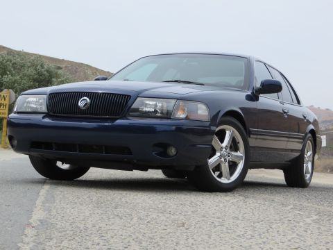 2003 Mercury Marauder - A dark blue 2003 Mercury Marauder is shown from a low front angle on a paved surface.