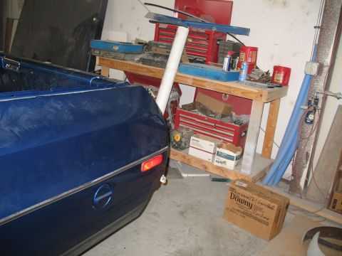 1972 Ford Ranchero - Rear view of a blue 1972 Ford Ranchero showing the quarter panel and bed with chrome trim and a red taillight.