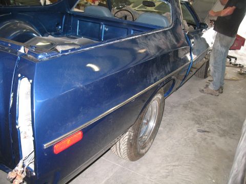 1972 Ford Ranchero - Blue 1972 Ford Ranchero in a shop, showing its side profile during what appears to be bodywork.