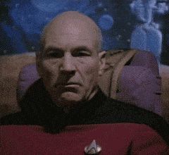 2000 Mercury Grand Marquis - Close-up of Captain Picard, looking serious in his red Starfleet uniform.
