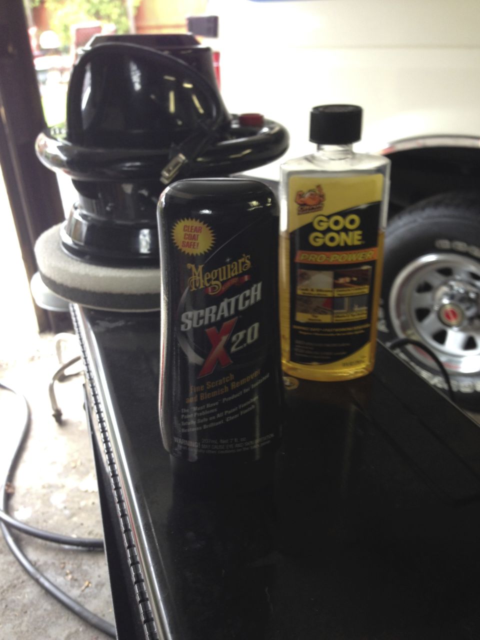 Found these worked the best.  Get the glue off and buff out the cleaned area.