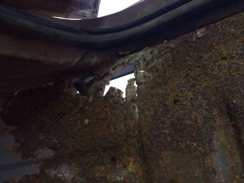 1991 Ford Bronco - Severe rust has compromised the structural integrity of the vehicle's floor pan.