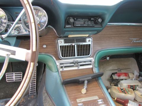 1963 Ford Thunderbird - Interior view of a 1963 Ford Thunderbird, including dashboard details and passenger side storage.