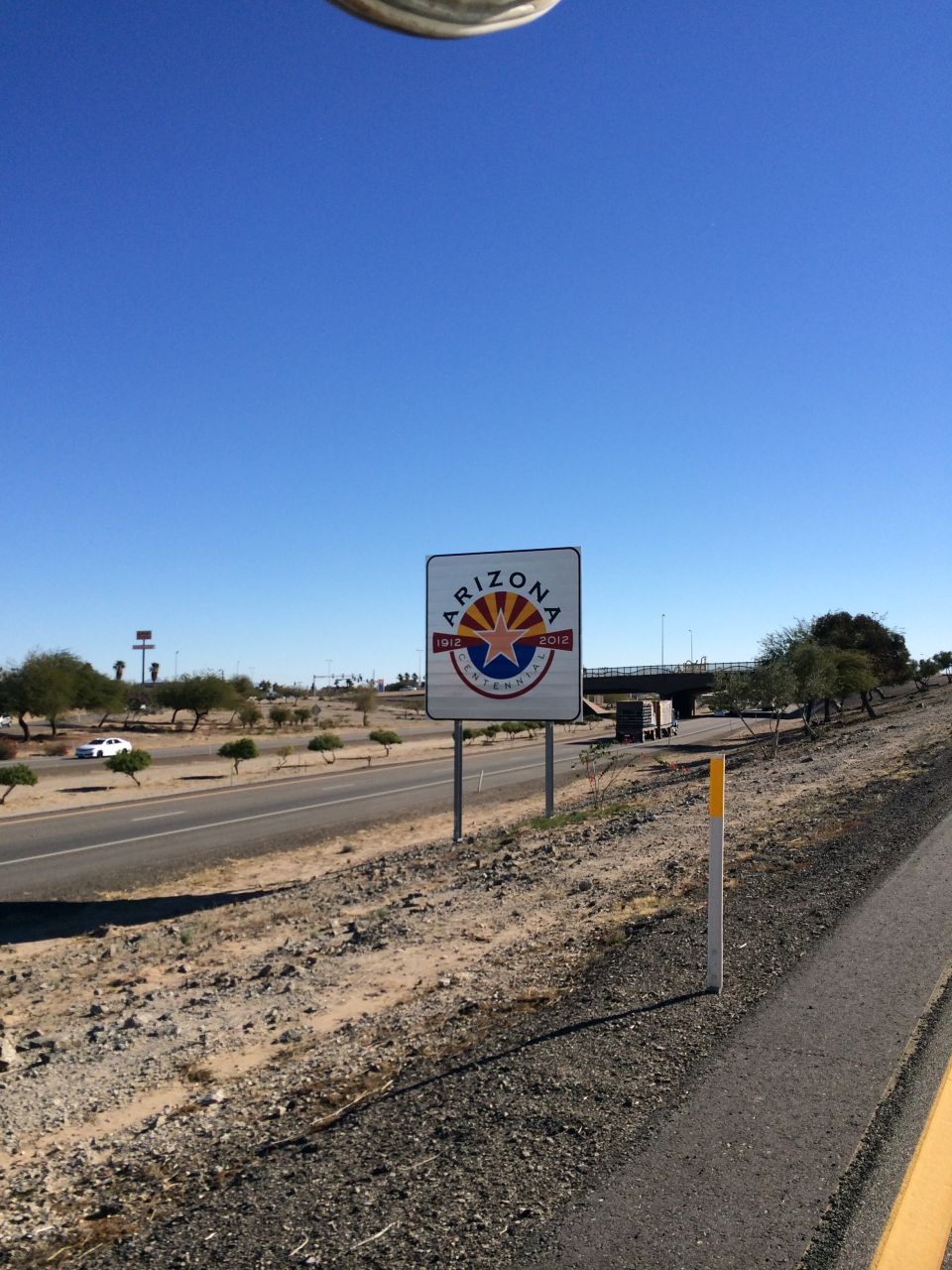 Arizona Centennial sign on roadside
