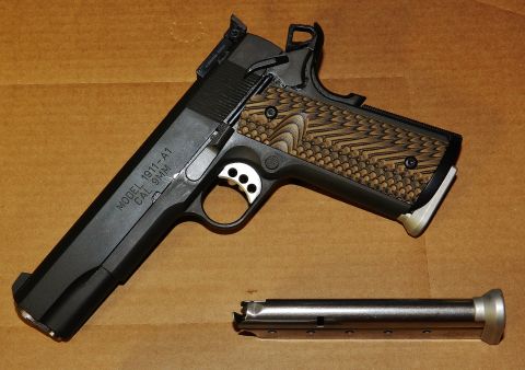 1996 Ford Bronco - Springfield 1911-A1 pistol in 9mm caliber, shown with its magazine.