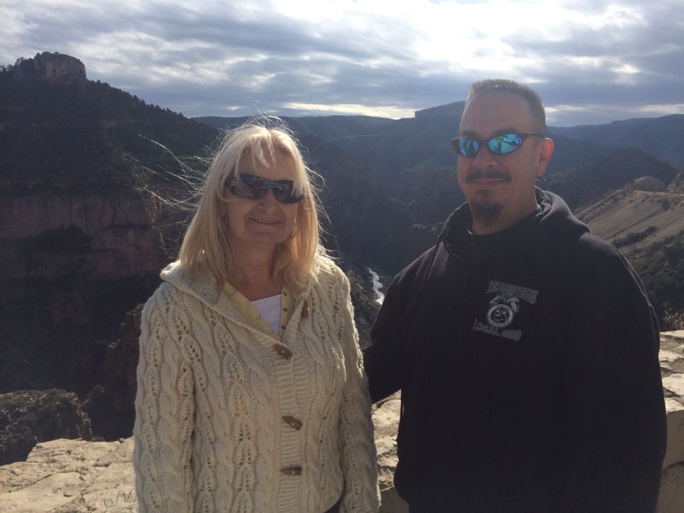 Couple posing in front of a scenic canyon overlook