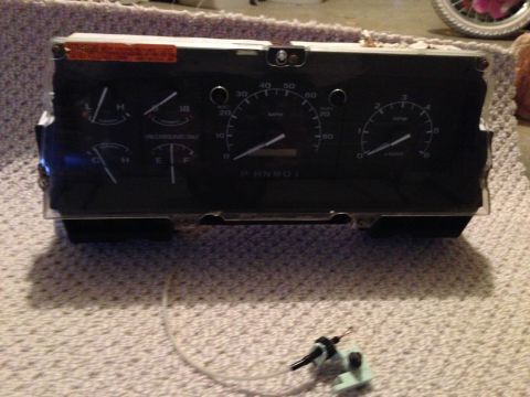 1995 Ford Bronco - Instrument cluster from a vehicle, showing gauges and indicators.
