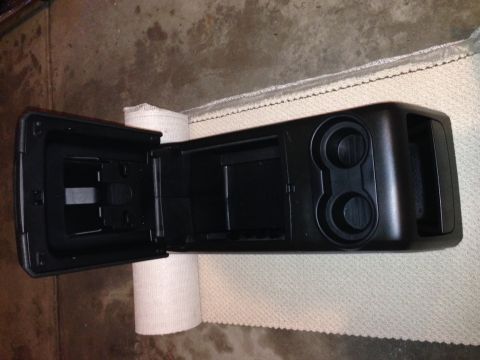 1995 Ford Bronco - Center console part with cup holders and storage compartment.
