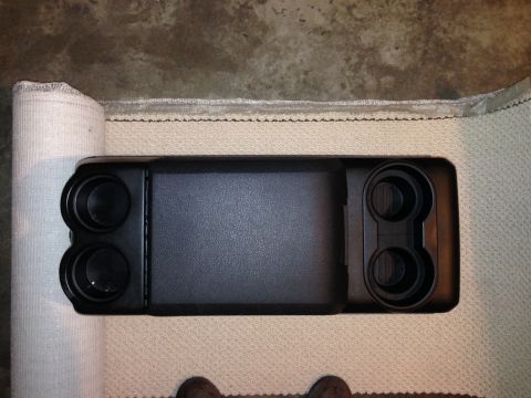 1995 Ford Bronco - Center console part with four cup holders and a storage area, viewed from above.