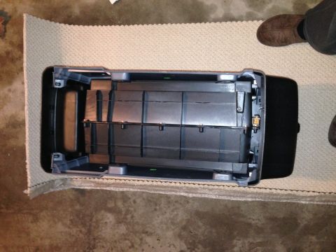 1995 Ford Bronco - Center console removed from a Ford Bronco, revealing internal storage sections.
