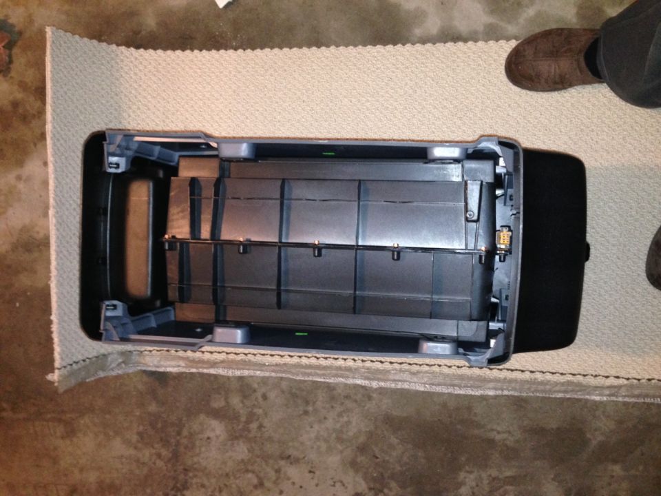 Ford Bronco center console removed from vehicle, showing storage compartments