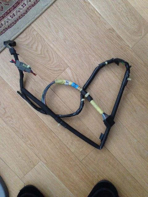 1995 Ford Bronco - This is a wiring harness, likely from a vehicle, with visible blue and yellow tape markings.
