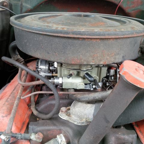 1978 Ford Bronco - Engine bay detail showing a carburetor and air intake system.