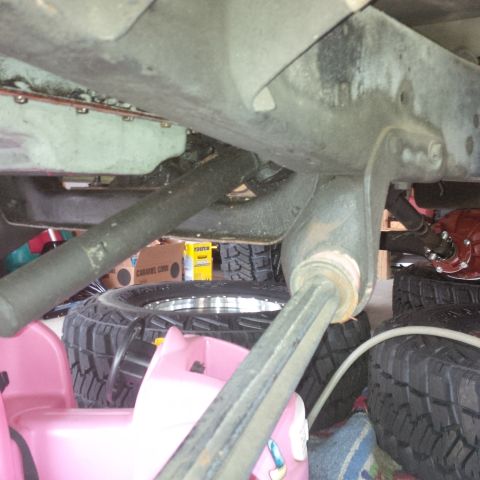 1978 Ford Bronco - Undercarriage view showing suspension parts and tires, with a "SuperMotors" watermark.